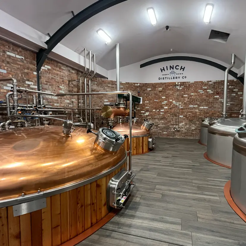 Hinch Distillery Brewing equipment showing pipes and vats