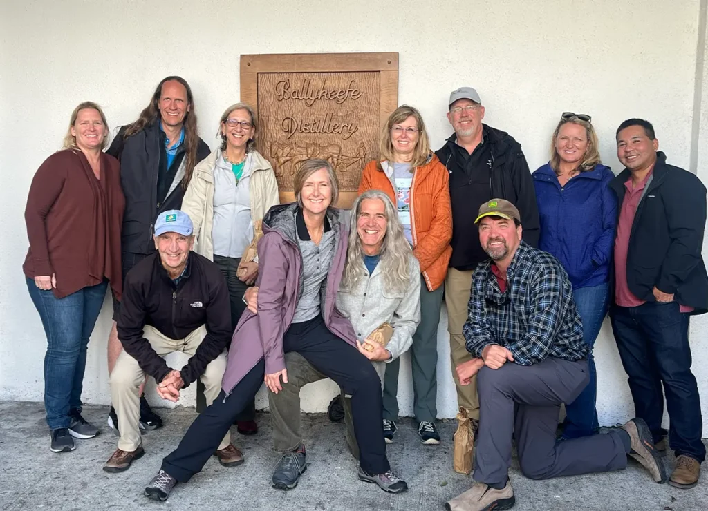 Tour Group in front of Ballykeefe Distillery Sign