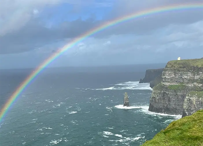 Rainbow going over cliff