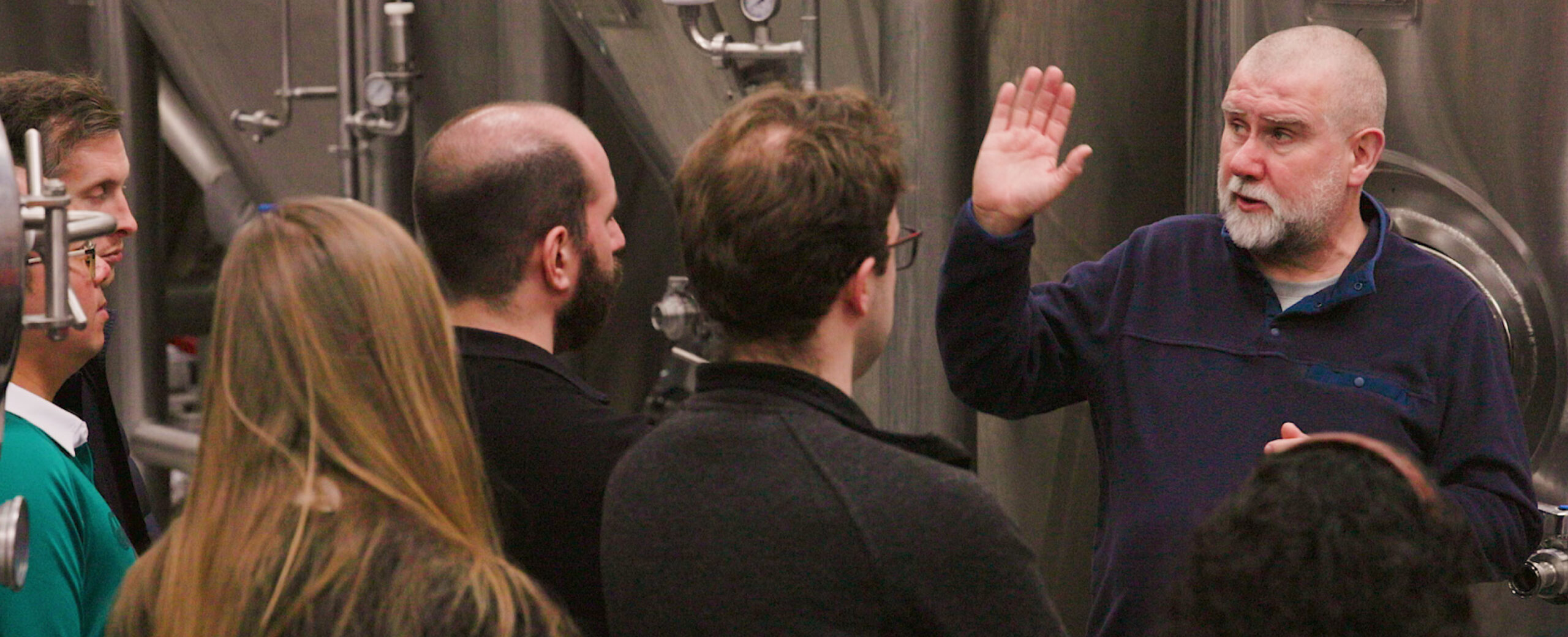 Tour group getting a talk about brewing
