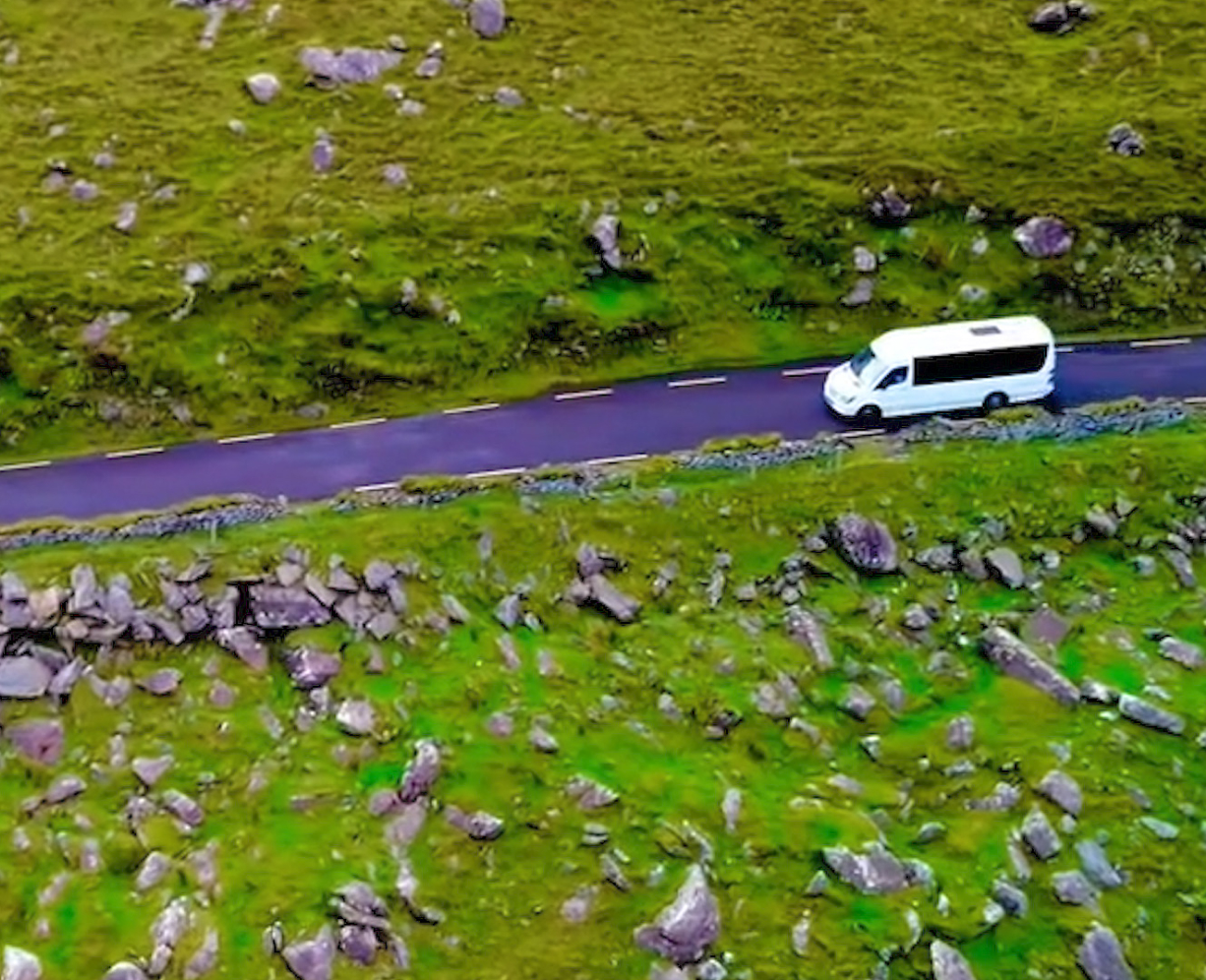 Bus driving along country road
