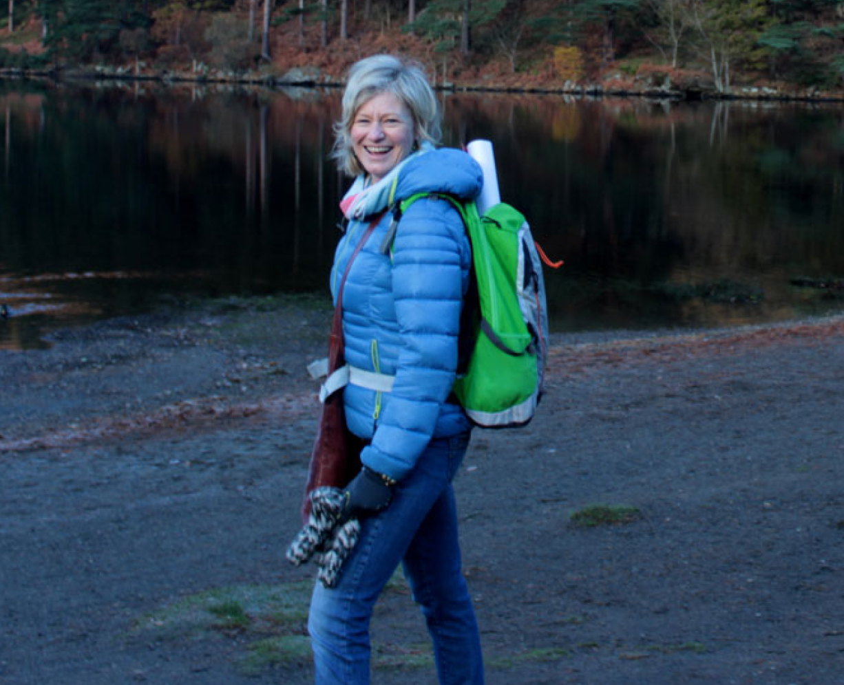 Mia standing in front of lake