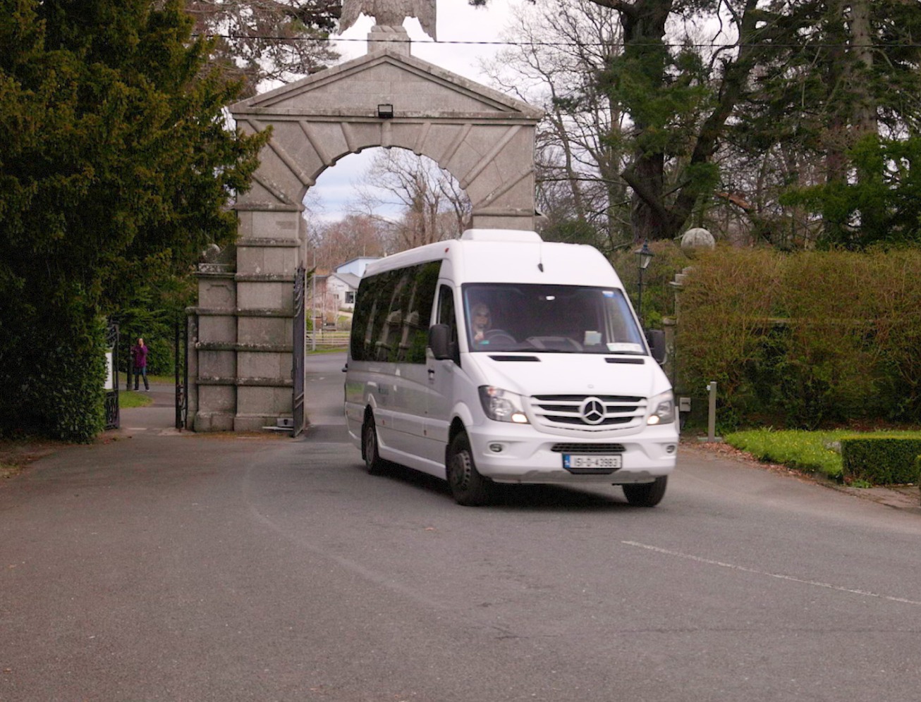 Van driving through archway