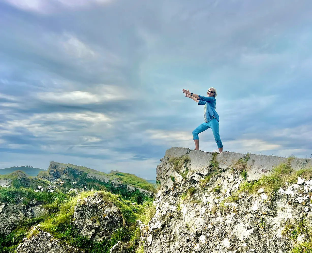 Mia Tobin standing on rocky mound